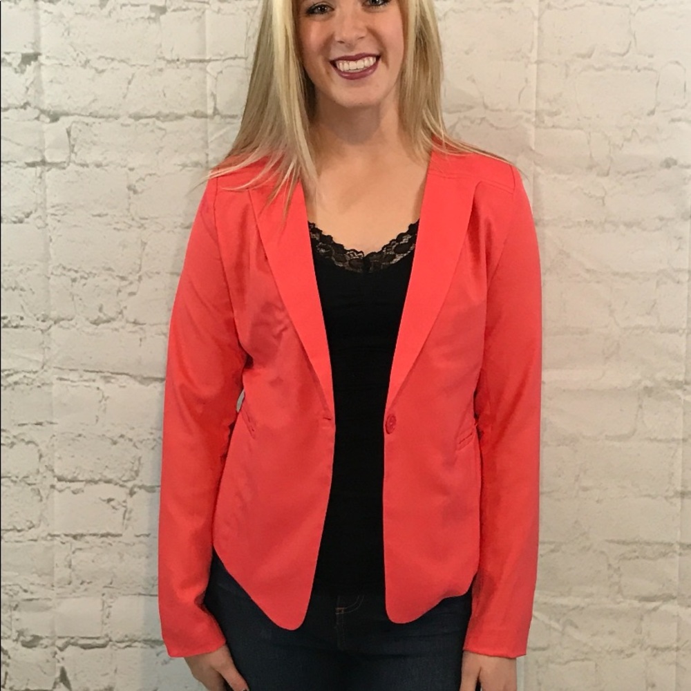 Darling coral jacket with embellishments and zipper on the back. Brand new.